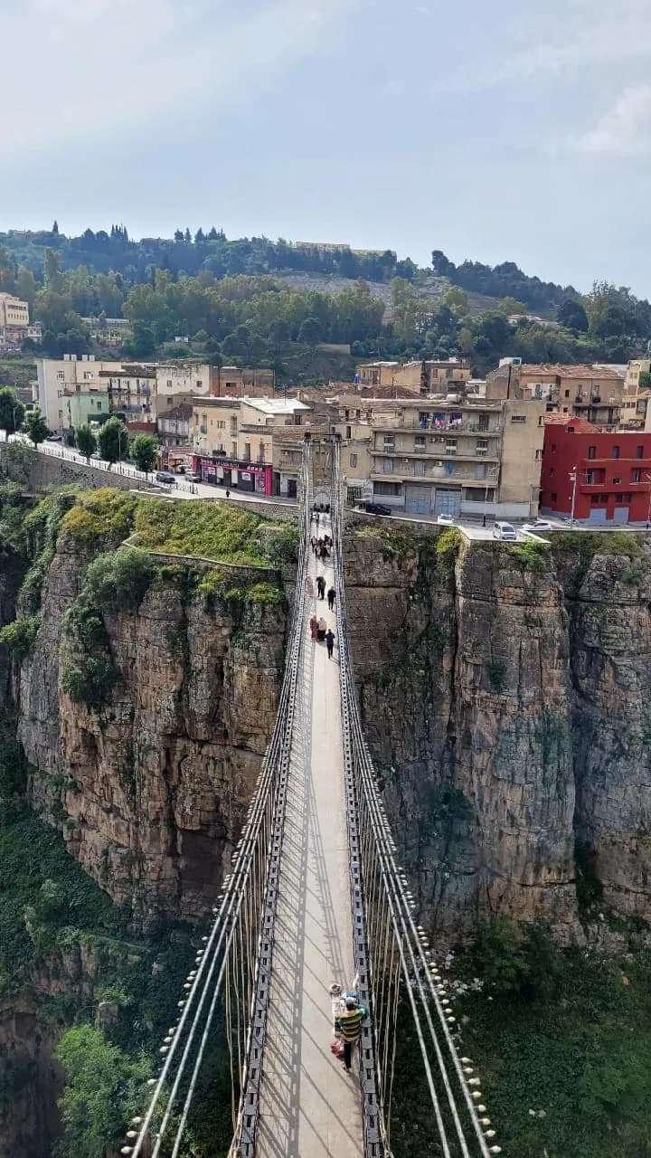 People crossing the Mellah Slimane footbridge over the gorge in Constantine
