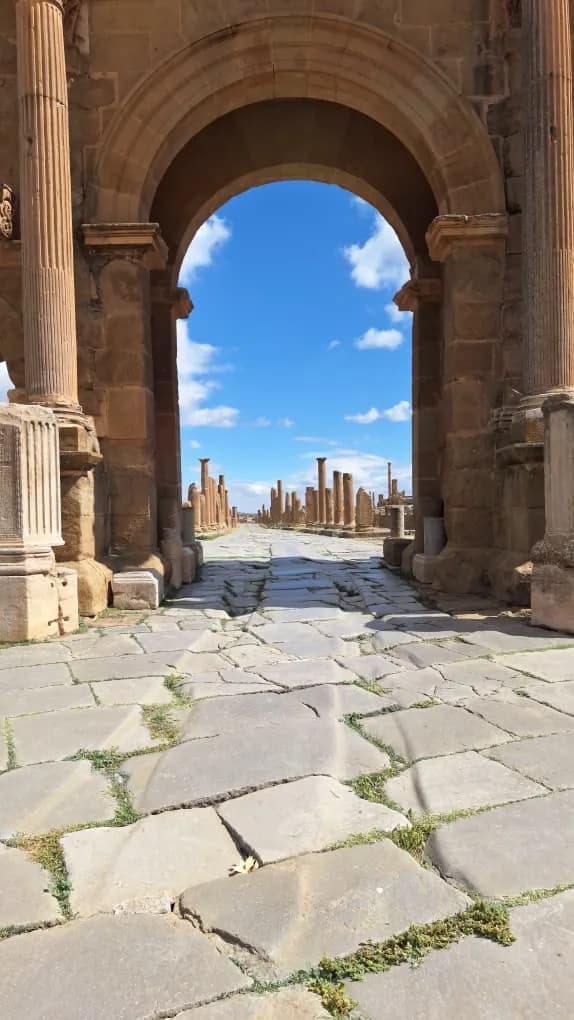 A Roman street in Timgad, seen through Trajan’s Arch